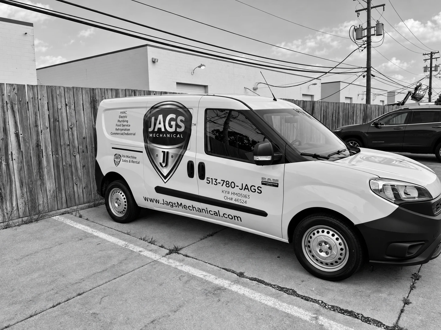 Finished commercial branding and lettering on a compact service van